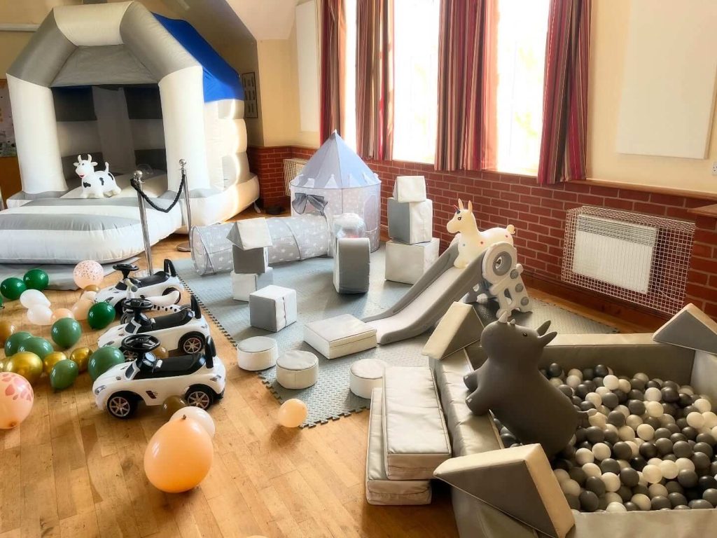 All inclusive soft play hire setup in Bedford complete with bouncy castle, ride on cars, play slides, ball pit and play boppers.