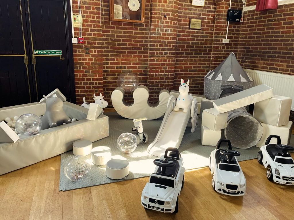 White and Grey essentials soft play package fully setup with ride on cars, play tent and tunnel and ball pit.